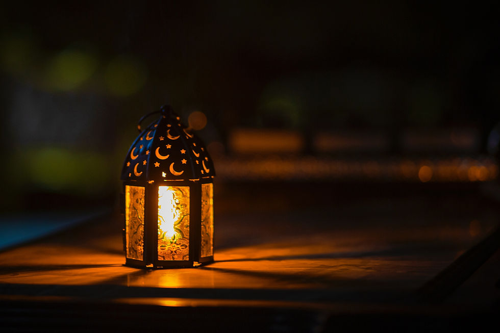 a garden lamp with moon shapes on it, in a dark setting.