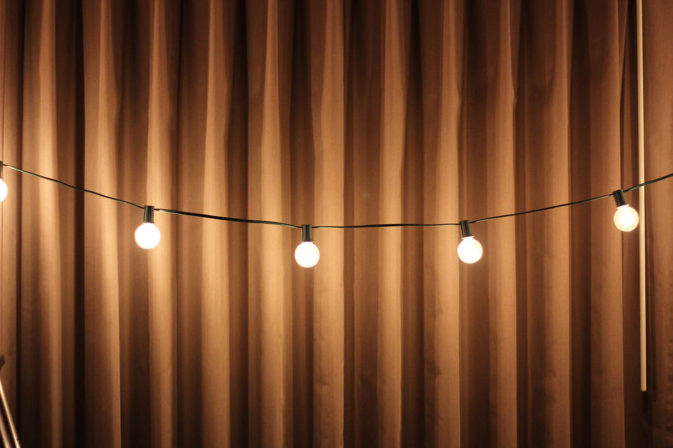 String lights lighting up a garden and creating a cosy atmosphere.